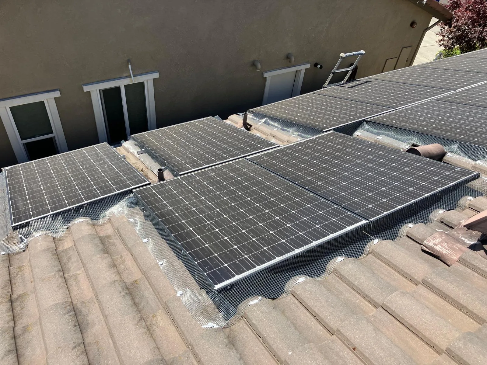 Bird exclusion mesh installed around residential solar panels