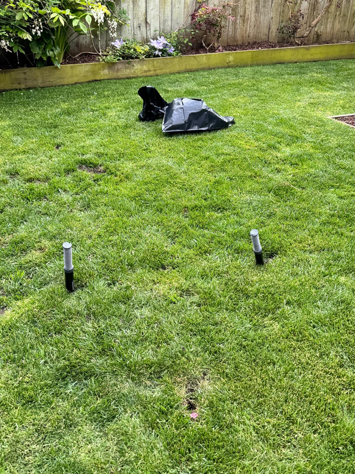 Multiple treatment access points positioned across a residential lawn