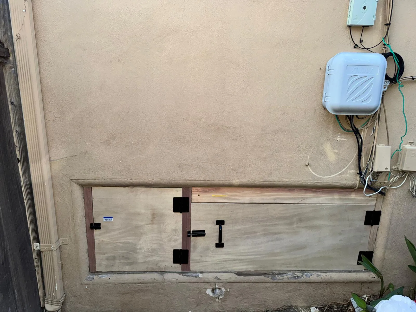 Custom secured access panel installed for rodent exclusion